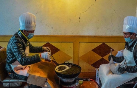Cooks preparing Kapsey for the Tibetan New Year Losar